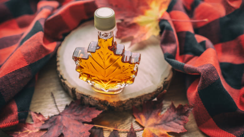 Maple leaf syrup bottle on wood
