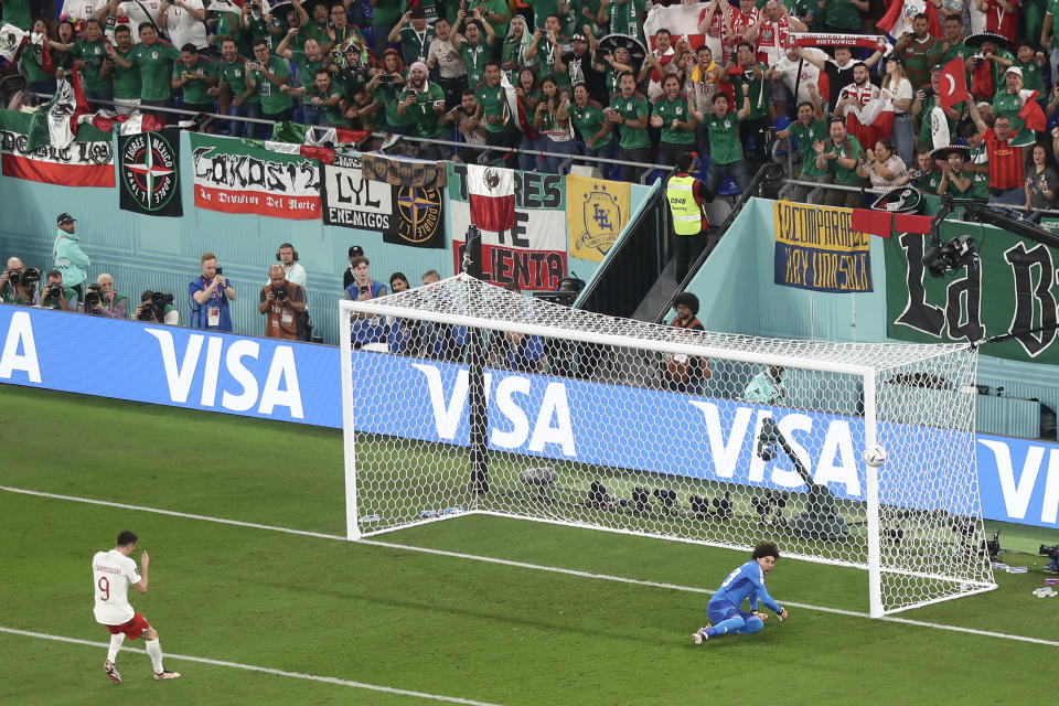 DOHA, QATAR - NOVEMBER 22: Robert Lewandowski of Poland reacts after his penalty saved by Guillermo Ochoa of Mexico during the FIFA World Cup Qatar 2022 Group C match between Mexico and Poland at Stadium 974 on November 22, 2022 in Doha, Qatar. (Photo by James Williamson - AMA/Getty Images)