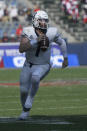 Utah State quarterback Logan Bonner (1) runs toward the end zone in the first half against the San Diego State during an NCAA college football game for the Mountain West Conference Championship, Saturday, Dec. 4, 2021, in Carson, Calif. (AP Photo/John McCoy)