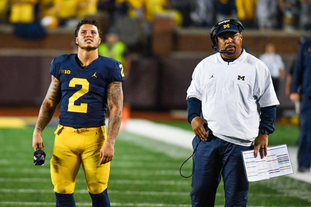 Michigan assistant Mike Hart carted off field after apparent medical episode