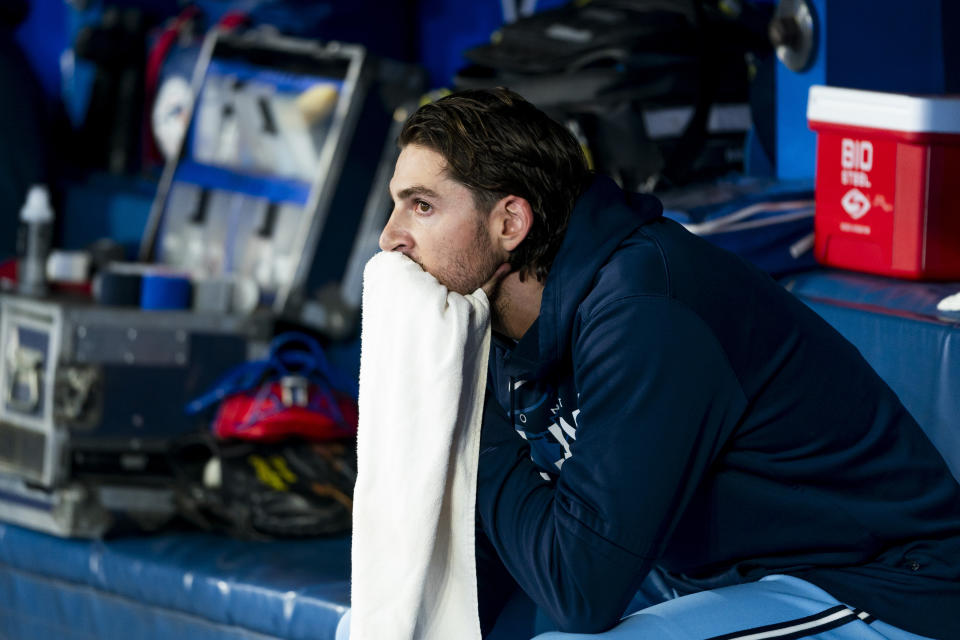 Toronto Blue Jays starting pitcher Kevin Gausman sits in the dugout during the fifth inning of the team's baseball game against the Texas Rangers on Thursday, Sept. 14, 2023, in Toronto. (Spencer Colby/The Canadian Press via AP)