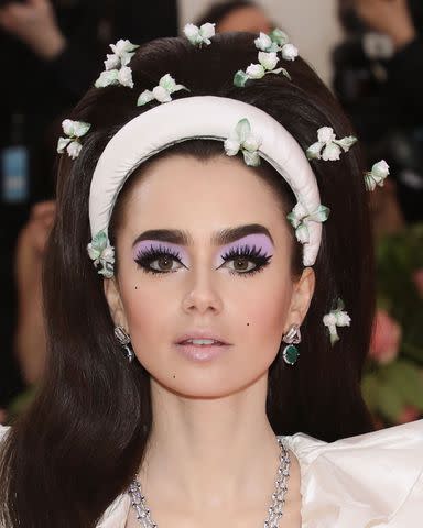 <p>Taylor Hill/FilmMagic</p> Lily Collins attends the 2019 Met Gala celebrating "Camp: Notes on Fashion" at The Metropolitan Museum of Art on May 6, 2019 in New York City