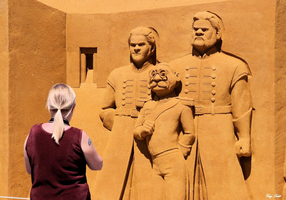 <p>Sand carver Susanne Paucker from Germany works on a sculpture during the Sand Sculpture Festival “Disney Sand Magic” in Ostend, Belgium. (Photo courtesy of Disneyland Paris) </p>