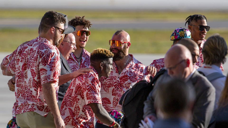 Kansas City Chiefs players pose with coach Andy Reid upon the team's arrival in Miami for Super Bowl LIV. (Daniel A. Varela/Miami Herald/TNS)