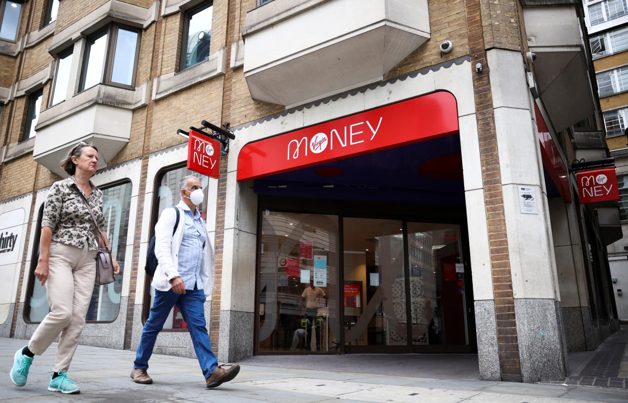 People walk past a Virgin Money store in central London, Britain, July 27, 2021. REUTERS/Henry Nicholls