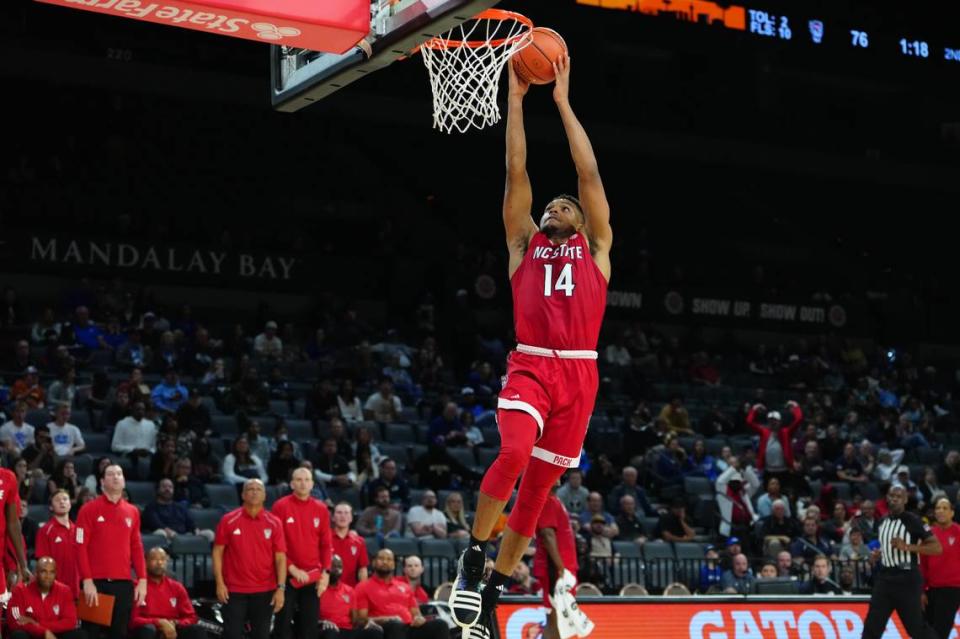 Nov 23, 2023; Las Vegas, Nevada, USA; North Carolina State Wolfpack guard Casey Morsell (14) shoots against the Vanderbilt Commodores during the second half at Michelob Ultra Arena.