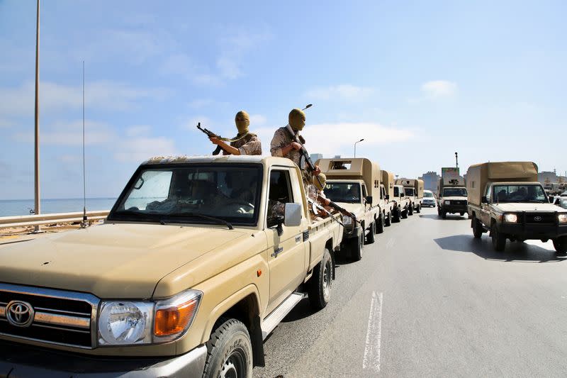 FILE PHOTO: Soldiers loyal to the head of Libya's Government of National Unity, Abdulhamid al-Dbeibah, sit in trucks in Tripoli
