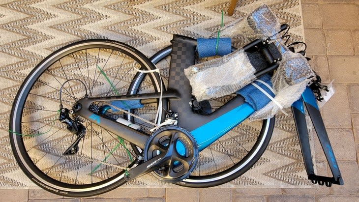 A packaged and bubble-wrapped used bike bought online at The Pros Closet