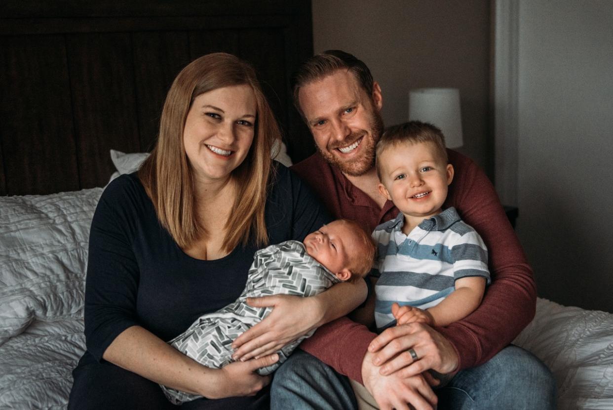 Bill Schammert (pictured with wife Kym and sons Cameron and Theo) is raising awareness about the importance of learning infant CPR following his newborn's health scare. (Photo: Emily Hardy Photography)