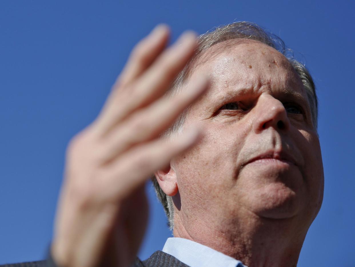 Doug Jones doesn't believe Donald Trump should step down over sexual misconduct allegations: Brynn Anderson/AP