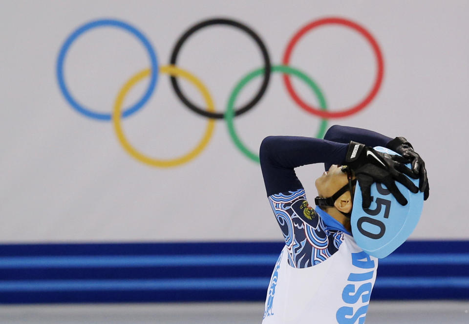 Victor An of Russia celebrates winning the men's 500m short track speedskating final at the Iceberg Skating Palace during the 2014 Winter Olympics, Friday, Feb. 21, 2014, in Sochi, Russia. (AP Photo/Vadim Ghirda)