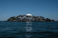 A newly-built tin roof shines on top of Migingo island where its residents fish mainly for Nile perch in Lake Victoria on the border of Uganda and Kenya