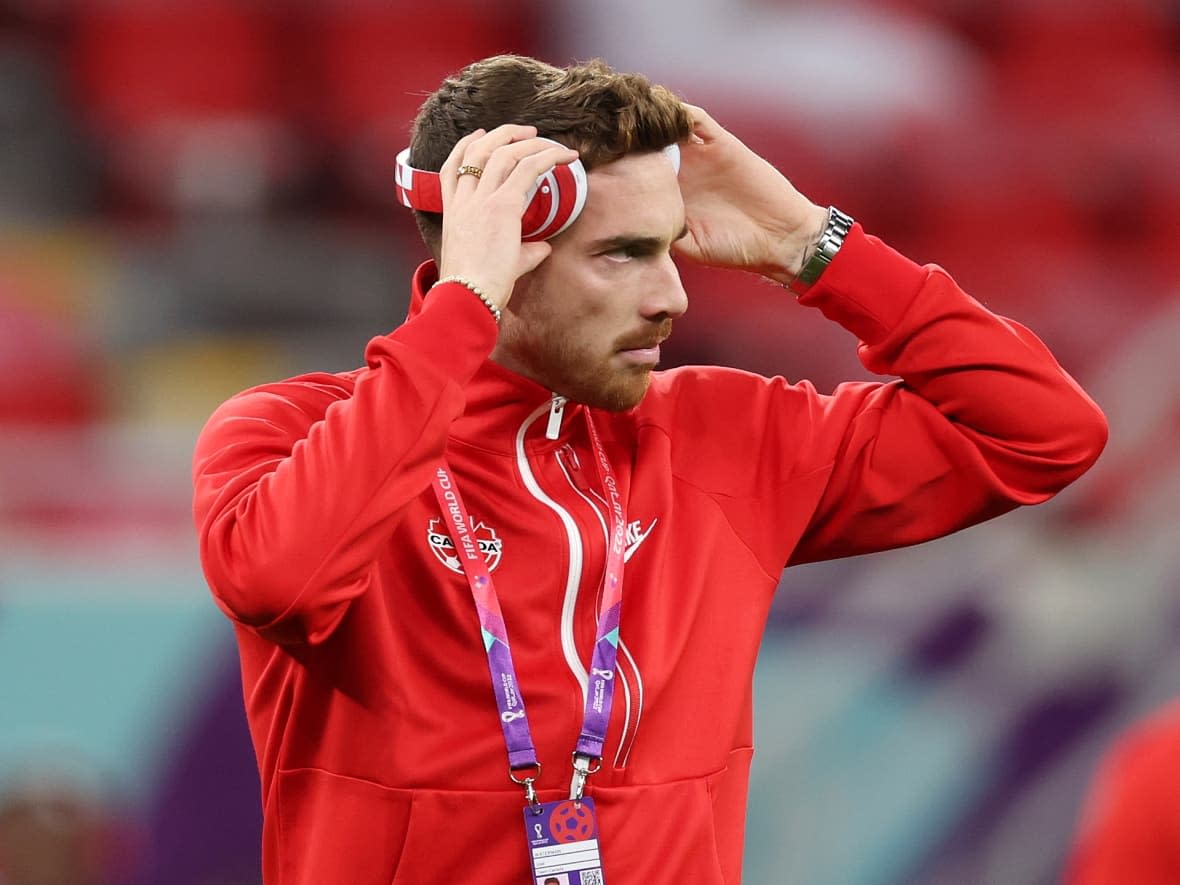 B.C.'s Joel Waterman, seen here inspecting the pitch prior to Canada's World Cup match against Belgium, says the Canadian team is ready for its Group F match against Croatia on Nov. 27, 2022.  (Photo by Clive Brunskill/Getty Images - image credit)