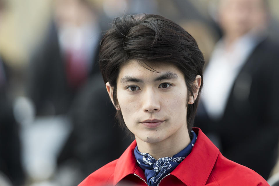 Japanese actor and singer Haruma Miura attends the Louis Vuitton men's Fall-Winter 2014-2015 fashion collection, presented Thursday, Jan. 16, 2014 in Paris. (AP Photo/Jacques Brinon)