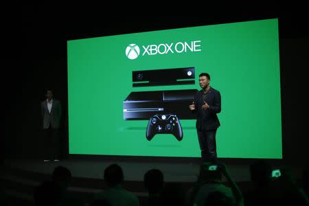 Xie Enwei, general manager of management and operations of Microsoft in China, speaks during the presentation of the Xbox One by Microsoft as part of ChinaJoy 2014 China Digital Entertainment Expo and Conference in Shanghai July 30, 2014. REUTERS/Carlos Barria