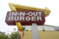 The sign to an In-N-Out restaurant is shown in San Francisco's Fisherman's Wharf, Wednesday, Oct. 20, 2021. The In-N-Out hamburger chain is sizzling mad after San Francisco shut down its indoor dining for refusing to check customers' vaccination status. The company's Fisherman's Wharf location, its only one in San Francisco, was temporarily shut by the Department of Public Health on Oct. 14. (AP Photo/Jeff Chiu)