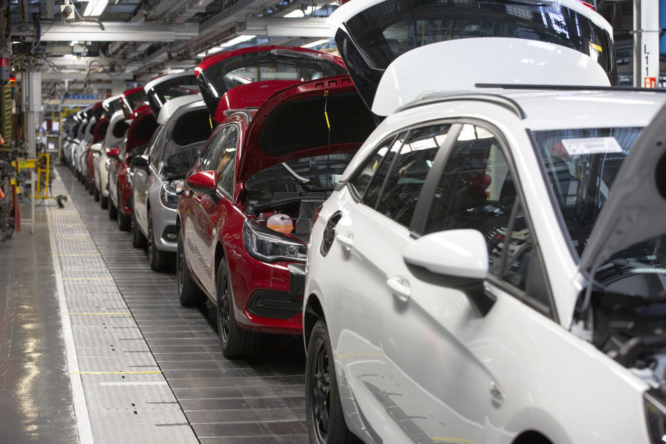 A line of cars on a car assembly line at the Vauxhall car factory. Photo: Getty