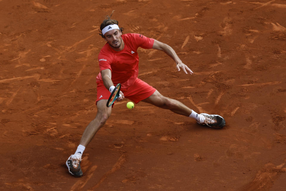 Stefanos Tsitsipas, of Greece, returns the ball against Dusan Lajovic, of Serbia, during a semi final open tennis tournament in Barcelona, Spain, Saturday, April 20, 2024. (AP Photo/Joan Monfort)