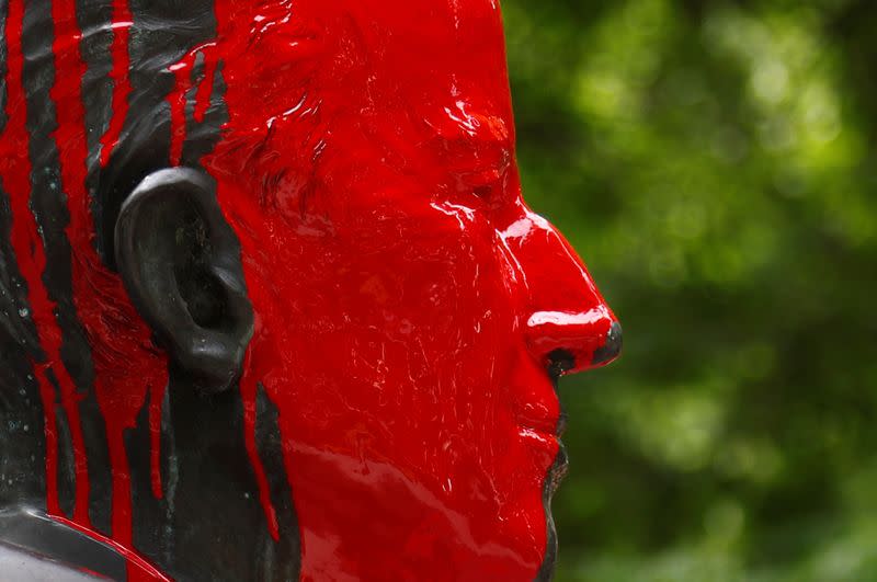 Statue of former Belgian King Baudouin is seen covered in red paint in Brussels