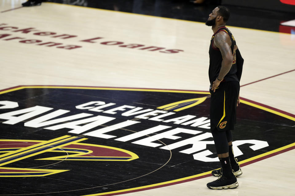 LeBron James confirmed a post-game report that he injured his hand in frustration after Game 1 and played the rest of the Finals with a hand contusion.. (AP Photo/Tony Dejak)