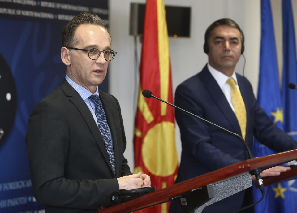 German Foreign Minister Heiko Maas, left, talks for the media during a news conference with his North Macedonia's counterpart Nikola Dimitrov, right, after their meeting in Skopje, North Macedonia, on Wednesday, Nov. 13, 2019. Maas arrived Wednesday in Skopje to discuss with his counterpart Nikola Dimitrov the bilateral relations and the further steps after North Macedonia has failed to open the membership talks with European Union last month. (AP Photo/Boris Grdanoski)