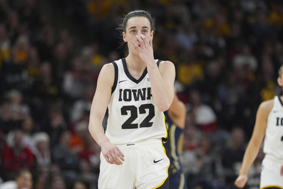 Iowa guard Caitlin Clark (22) reacts after missing a shot during the first half of a Big Ten tournament game. (AP Photo/Abbie Parr)