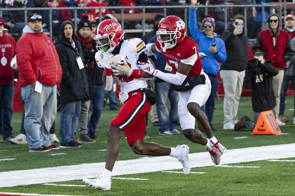 Maryland wide receiver Tai Felton, left, catches a pass in front of Rutgers defensive back Robert Longerbeam (7) and runs in for a touchdown in the first half of an NCAA college football game, Saturday, Nov. 25, 2023, in Piscataway, N.J. (AP Photo/Corey Sipkin)
