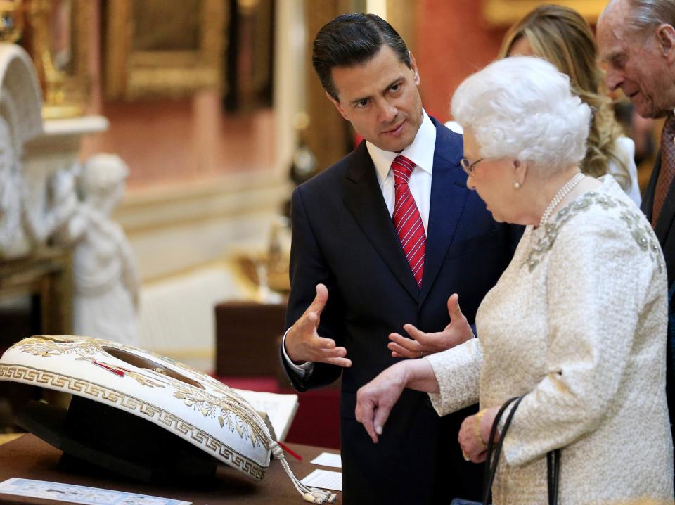 The President of Mexico Enrique Pena Nieto is shown Mexican items in the Royal Collection by Britain's Queen Elizabeth at Buckingham Palace, London