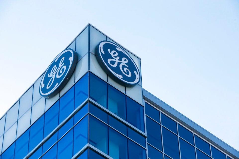 In this Jan. 16, 2018, file photo, the General Electric logo is displayed at the top of their Global Operations Center in the Banks development of downtown Cincinnati.