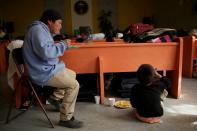 Migrants from Central America, sent back to Mexico to await their outcome of their cases under the Migrant Protection Protocols (MPP), eat at El Buen Pastor shelter in Ciudad Juarez