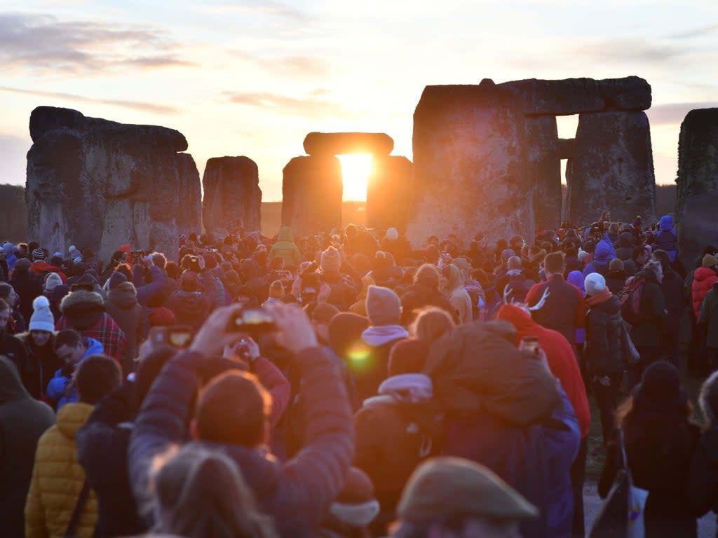 People gather at Stonehenge in Wiltshire to mark the winter solstice (Ben Birchall/PA Wire)