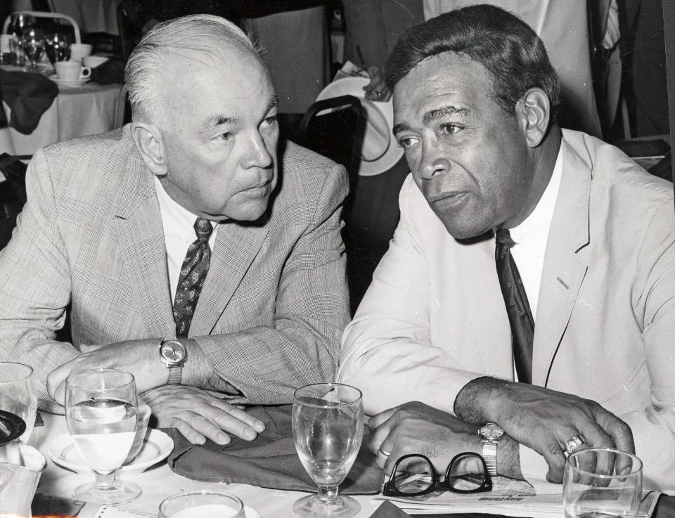 Edward Lamb and William H. Brooks talk after a speech by Vice President Hubert Humphrey at the 1968 Democratic National Convention in Chicago.