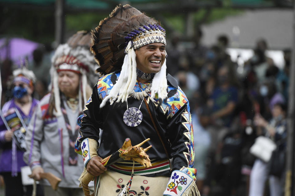 Rodney Butler, Chairman of the Mashantucket Pequot Tribal Nation, participates in the Schemitzun grand entry on Mashantucket Pequot Reservation, in Mashantucket, Conn., Wednesday, Aug. 28, 2021. Connecticut and a handful of other states have recently decided to mandate students be taught about Native American culture and history. (AP Photo/Jessica Hill)