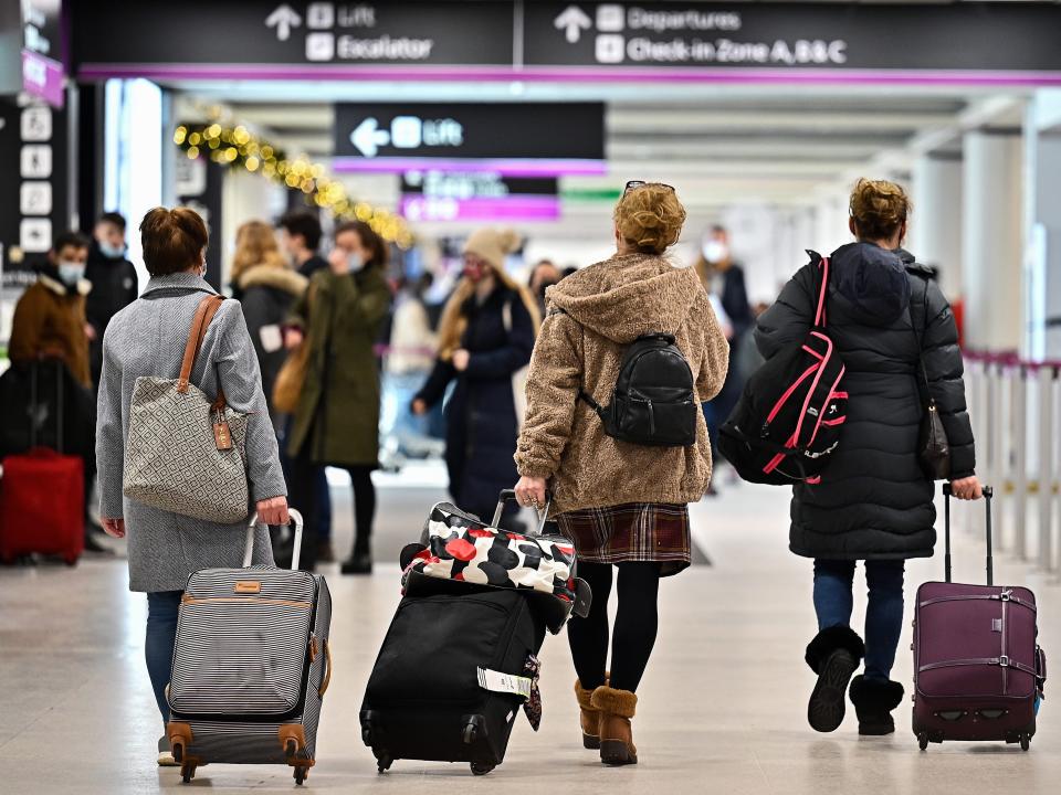 Passengers are seen at Edinburgh airport.