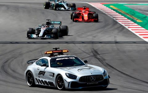 A safety car leads drivers during the Spanish Formula One Grand Prix at the Circuit de Catalunya in Montmelo in the outskirts of Barcelona on May 13, 2018 - Credit: AFP