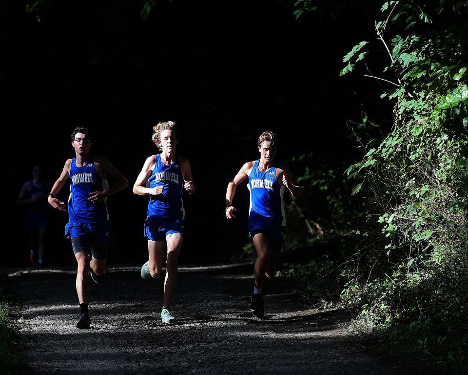 Norwell's Sam Foster, Connor Ready, and Thomas Corbett finish one, two, three during their dual meet against Cohasset at Wheelwright Park in Cohasset on Thursday, Sept. 8, 2022. Norwell boys won 15-50 while Norwell girls won 22-33.