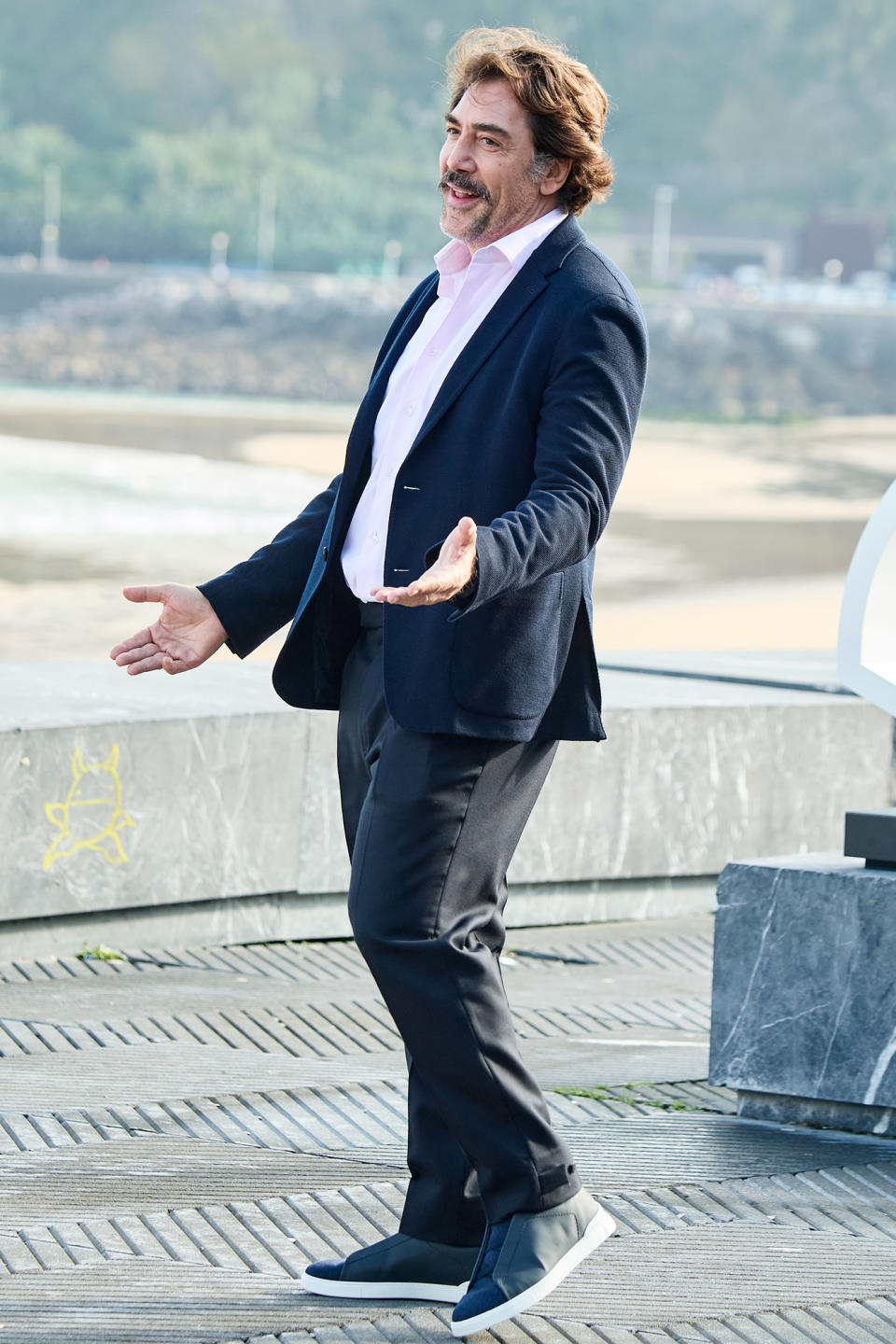 <p>Javier Bardem arrives with arms wide open at the premiere of <em>The Good Boss</em> at the 69th San Sebastian Film Festival in Spain on Sept. 21.</p>