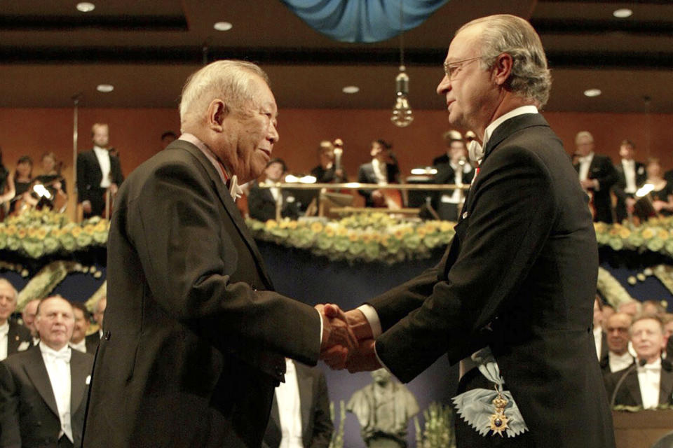 FILE - In this Dec. 10, 2002, file photo, Japanese physicist Masatoshi Koshiba receives the Nobel Prize in Physics in 2002 from King Carl Gustaf of Sweden during a ceremony at the Concert Hall in Stockholm, Sweden. Koshiba, a co-winner of the Nobel Prize for his pioneering researches into the make-up of the universe, died Thursday, Nov. 12, 2020, the University of Tokyo said. He was 94. (Jonas Ekstromer/Pool Photo via AP, File)