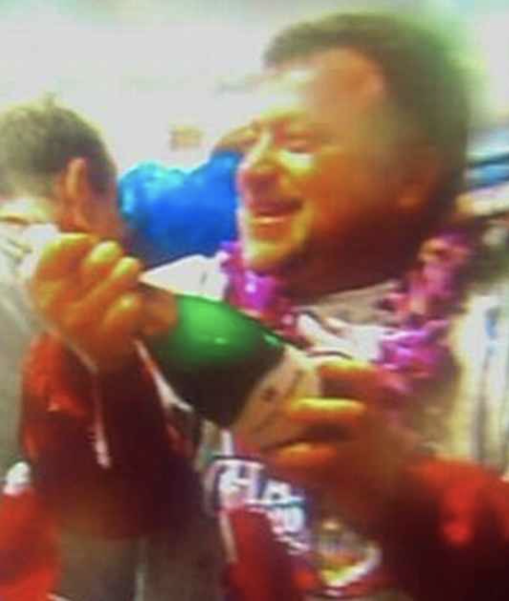 closeup of the fan with a champagne bottle