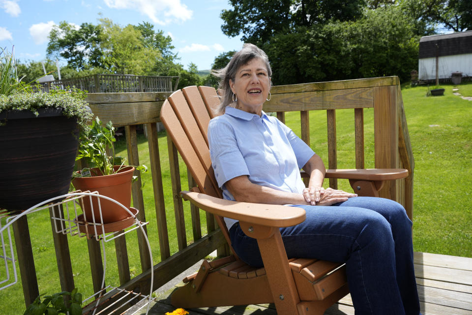 Susan Pryce sits on the back porch of her Derry, Pa., home, Saturday, May 11, 2024. A Democratic group is rolling out a new $140 million ad campaign this week that aims to chip away at Donald Trump’s support among one of his most loyal voting blocs: rural voters. Pryce, 74, a retired nurse, has offered a litany of reasons why she does not support Trump, from his comments maligning the late Sen. John McCain, a former prisoner of war, to his history of bragging about sexually abusing women.(AP Photo/Gene J. Puskar)