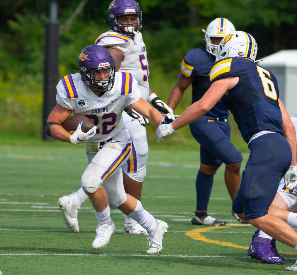 Former Corning Hawks standout Max Freeman carries the ball for the Alfred University football team during the 2022 season.