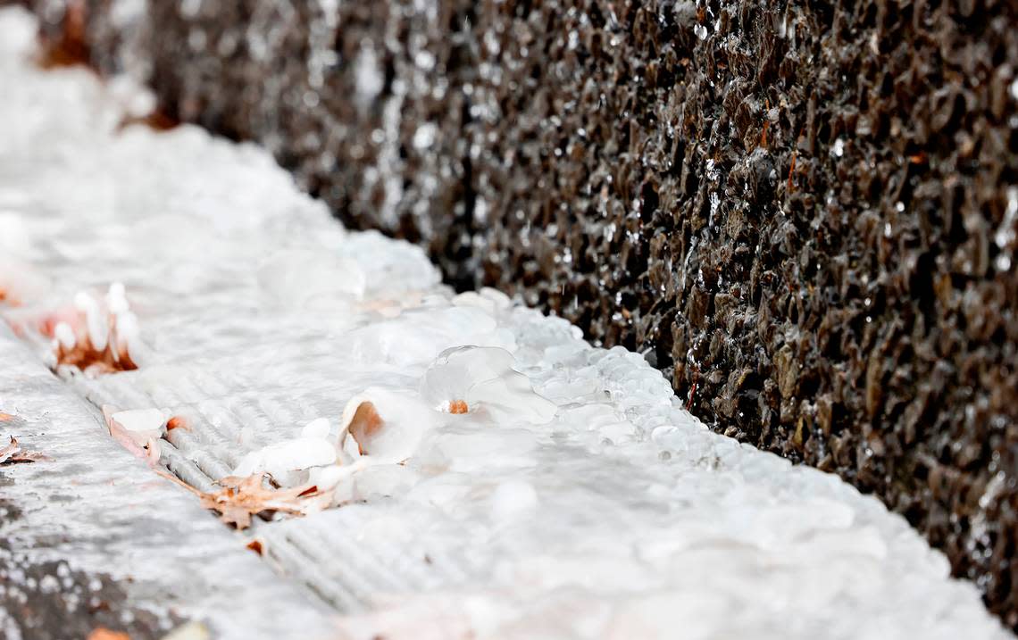 Water from a fountain outside of AT&T Stadium is frozen during a Winter Weather Advisory on Sunday, January 14, 2024, in Arlington.