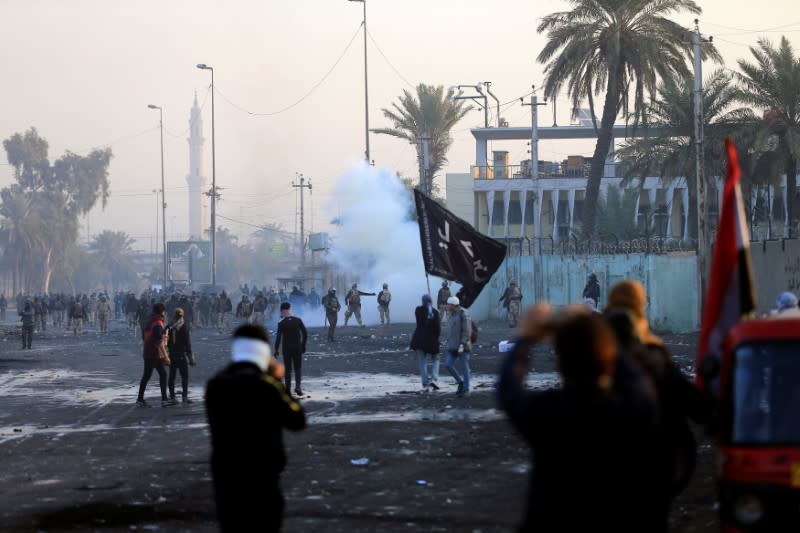 Members of Iraqi security forces are seen during ongoing anti-government protests in Baghdad