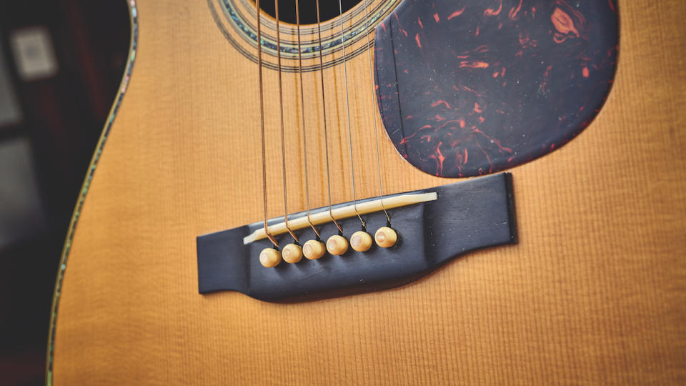 A close up of the front of a vintage 1941 Martin acoustic guitar