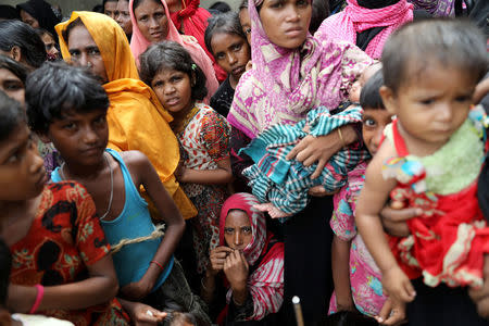 Rohingya refugees wait for humanitarian aid to be distributed at the Balu Khali refugee camp in Cox's Bazar, Bangladesh October 5, 2017. REUTERS/Mohammad Ponir Hossain