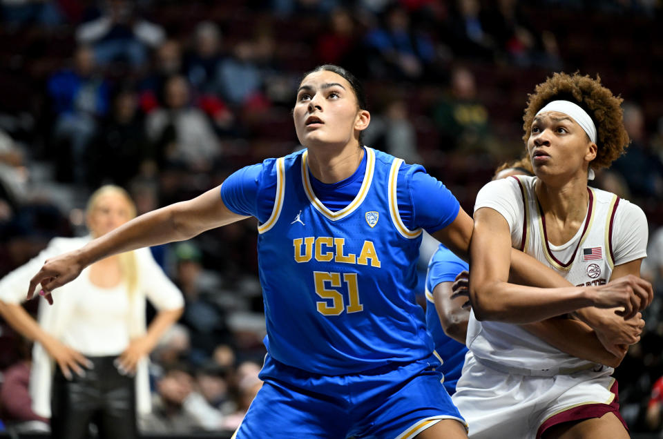 UCLA's Lauren Betts boxes out against Florida State's Makayla Timpson during the Women's Hall of Fame Showcase at Mohegan Sun Arena in Uncasville, Connecticut, on Dec. 10, 2023. (Photo by G Fiume/Getty Images)