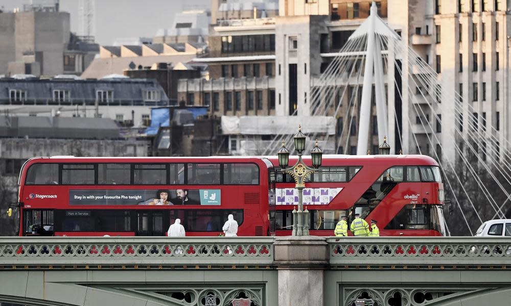 Police and forensic science officers on Westminster bridge.