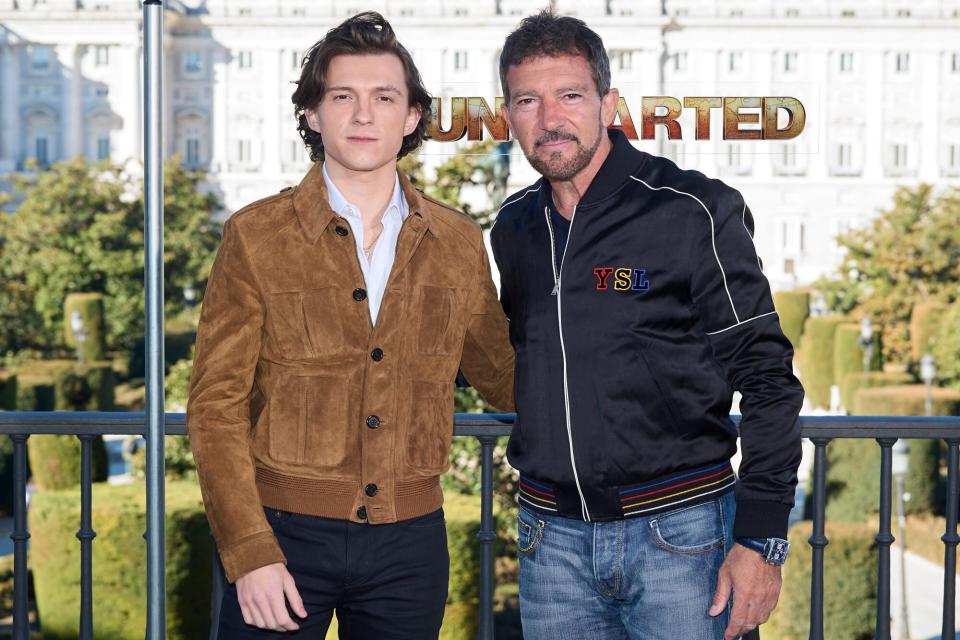 MADRID, SPAIN - FEBRUARY 08: Actors Tom Holland (L) and Antonio Banderas (R) attend 'Uncharted' photocall at the Royal Theater on February 08, 2022 in Madrid, Spain. (Photo by Carlos Alvarez/Getty Images)