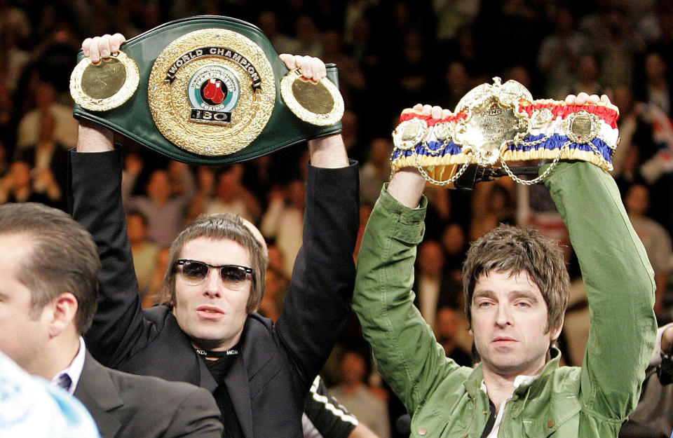 Liam Gallagher and Noel hold up England's Ricky Hatton Belts before defeating USA's Paulie Malignaggi during the IBF Light-Welterweight fight at the MGM Grand Hotel, Las Vegas, USA.   (Photo by Dave Thompson - PA Images/PA Images via Getty Images)