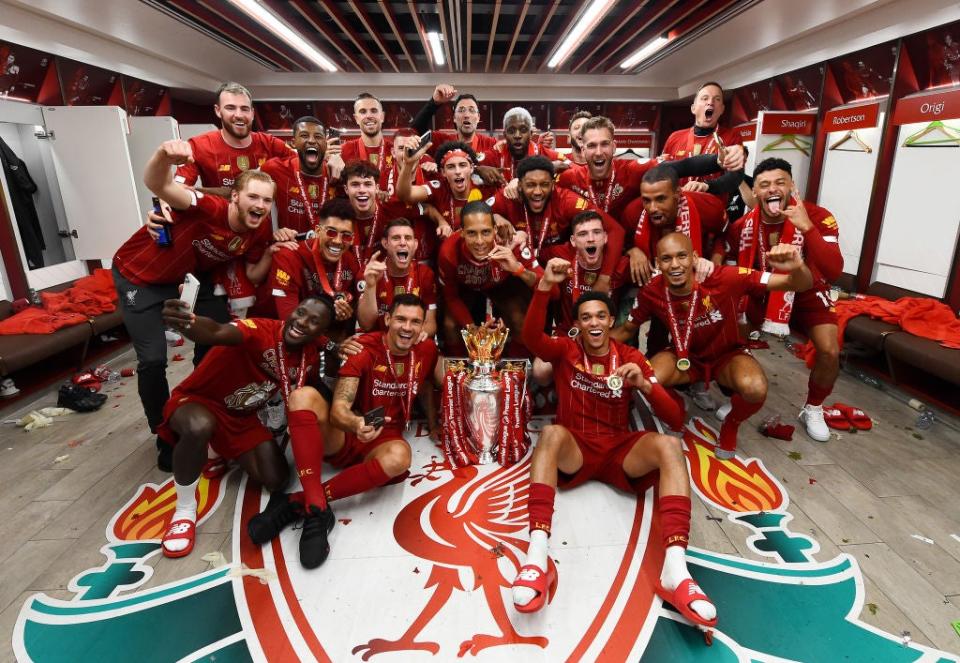 Liverpool celebrate with the Premier League trophy (Liverpool FC via Getty Images)